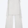 Pantalones con falda de talle medio y tachuelas – Blanco roto Pantalones con falda de talle medio y tachuelas – Blanco roto