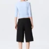 Pantalones cortos de traje de talle bajo y corte holgado con pliegues – Negro Pantalones cortos de traje de talle bajo y corte holgado con pliegues – Negro