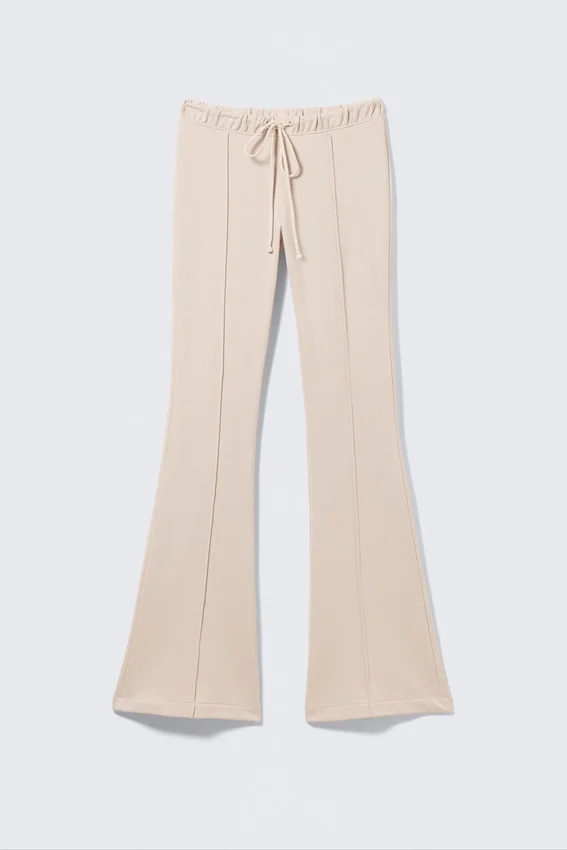 Pantalones de chándal acampanados con pinzas y talle medio – Beige claro Pantalones de chándal acampanados con pinzas y talle medio – Beige claro