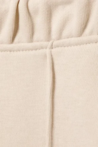 Pantalones de chándal acampanados con pinzas y talle medio – Beige claro Pantalones de chándal acampanados con pinzas y talle medio – Beige claro