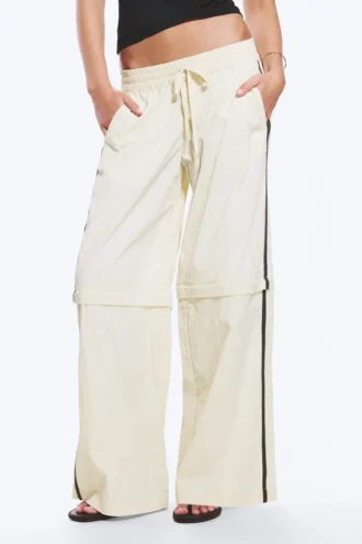 Pantalones de chándal de nailon con cremallera desmontable – Beige – Rayas negras