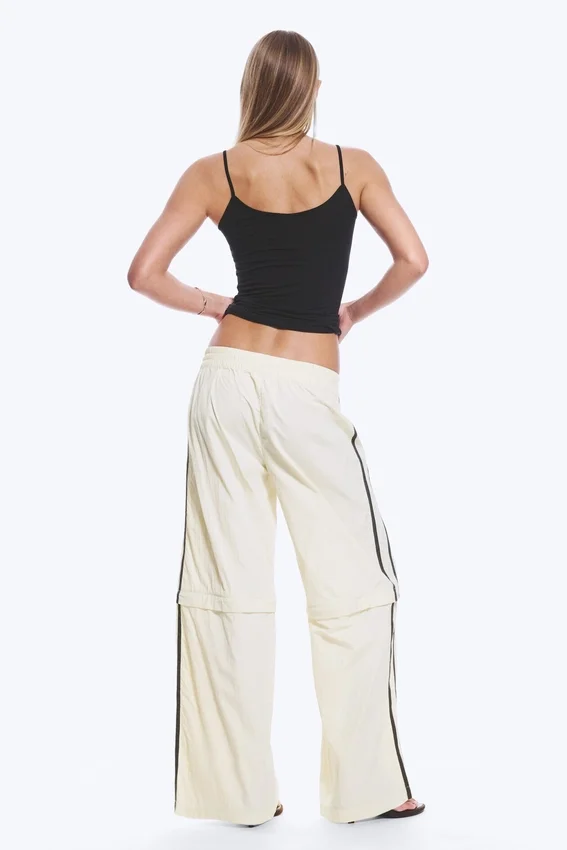 Pantalones de chándal de nailon con cremallera desmontable – Beige – Rayas negras Pantalones de chándal de nailon con cremallera desmontable – Beige – Rayas negras