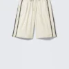 Pantalones de chándal de nailon con cremallera desmontable – Beige – Rayas negras Pantalones de chándal de nailon con cremallera desmontable – Beige – Rayas negras