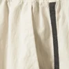 Pantalones de chándal de nailon con cremallera desmontable – Beige – Rayas negras Pantalones de chándal de nailon con cremallera desmontable – Beige – Rayas negras