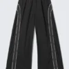 Pantalones de chándal de pierna ancha con ribetes en contraste – Negro Pantalones de chándal de pierna ancha con ribetes en contraste – Negro