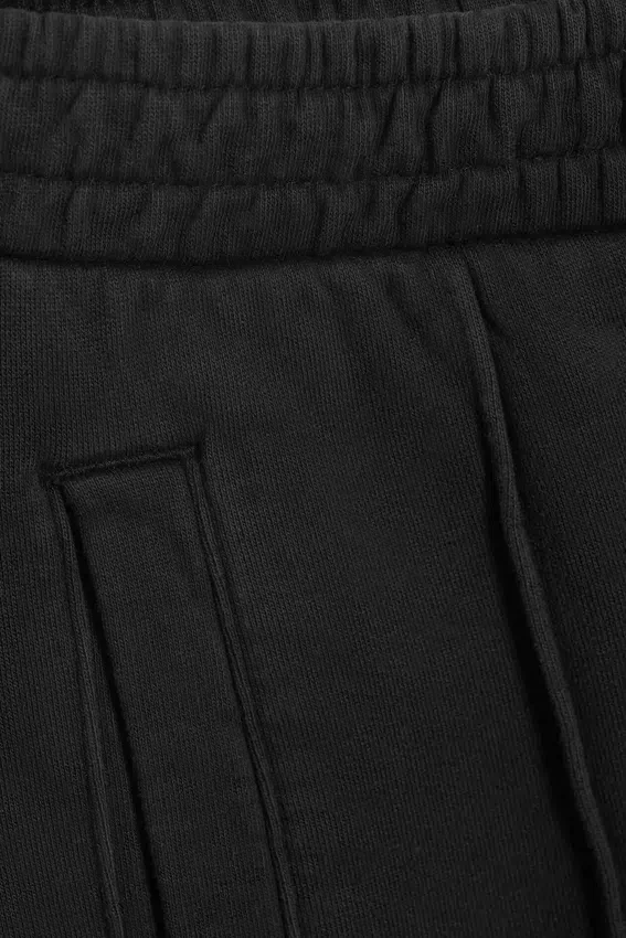 Pantalones de chándal holgados con pliegue delantero – Negro lavado Pantalones de chándal holgados con pliegue delantero – Negro lavado
