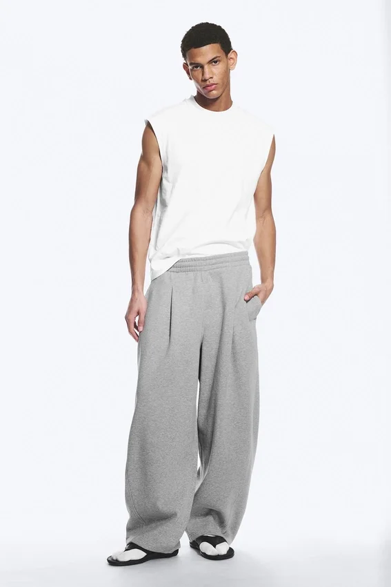 Pantalones de chándal holgados con pliegues – Gris jaspeado Pantalones de chándal holgados con pliegues – Gris jaspeado