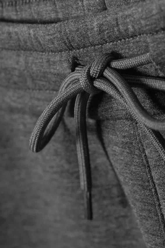Pantalones de chándal holgados de tejido scuba – Gris oscuro jaspeado Pantalones de chándal holgados de tejido scuba – Gris oscuro jaspeado