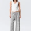 Pantalones de lyocell de talle medio, corte holgado y pierna ancha – Blanco – Rayas grises Pantalones de lyocell de talle medio, corte holgado y pierna ancha – Blanco – Rayas grises