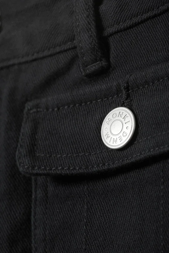Pantalones de sarga de corte acampanado y cintura baja – Negro Pantalones de sarga de corte acampanado y cintura baja – Negro