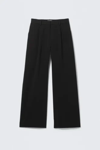 Pantalones de traje plisados de talle medio y corte holgado – Negro