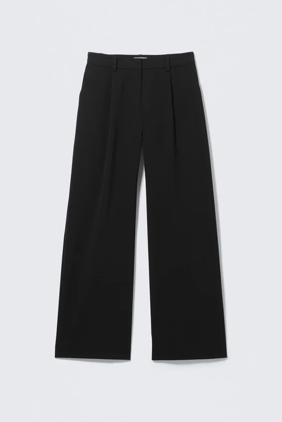 Pantalones de traje plisados de talle medio y corte holgado – Negro Pantalones de traje plisados de talle medio y corte holgado – Negro
