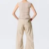 Pantalones holgados de talle bajo con tachuelas y corte acampanado – Beige Pantalones holgados de talle bajo con tachuelas y corte acampanado – Beige