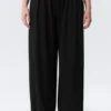 Pantalones holgados de talle medio con efecto globo – Negro