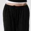 Pantalones holgados de talle medio con efecto globo – Negro