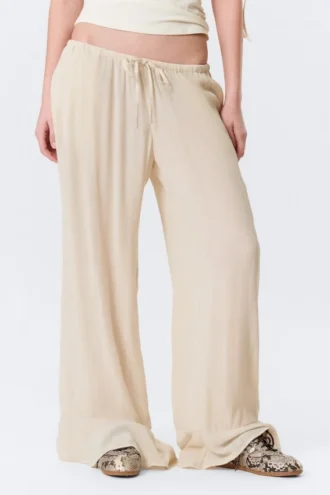 Pantalones holgados de talle medio con volantes – Beige claro