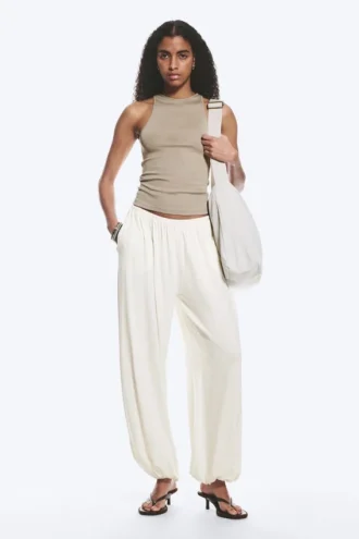 Pantalones holgados de talle medio y corte acampanado – Blanco