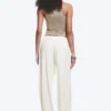 Pantalones holgados de talle medio y corte acampanado – Blanco Pantalones holgados de talle medio y corte acampanado – Blanco