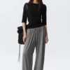 Pantalones holgados de talle medio y corte acampanado – Gris jaspeado Pantalones holgados de talle medio y corte acampanado – Gris jaspeado