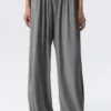 Pantalones holgados de talle medio y corte acampanado – Gris jaspeado Pantalones holgados de talle medio y corte acampanado – Gris jaspeado