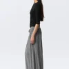 Pantalones holgados de talle medio y corte acampanado – Gris jaspeado Pantalones holgados de talle medio y corte acampanado – Gris jaspeado