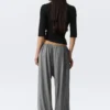 Pantalones holgados de talle medio y corte acampanado – Gris jaspeado Pantalones holgados de talle medio y corte acampanado – Gris jaspeado