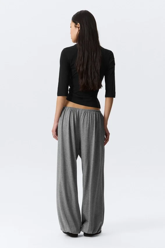 Pantalones holgados de talle medio y corte acampanado – Gris jaspeado Pantalones holgados de talle medio y corte acampanado – Gris jaspeado