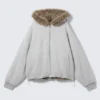 Sudadera con capucha reversible de pelo sintético con cremallera – Gris jaspeado y marrón Sudadera con capucha reversible de pelo sintético con cremallera – Gris jaspeado y marrón