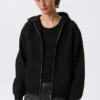 Sudadera con capucha y cremallera clásica – Negro Sudadera con capucha y cremallera clásica – Negro