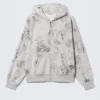 Sudadera con capucha y cremallera con estampados – Gris jaspeado – Estampado de garabatos Sudadera con capucha y cremallera con estampados – Gris jaspeado – Estampado de garabatos
