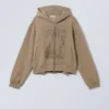 Sudadera con capucha y cremallera de corte recto y estampado, de tejido grueso – Beige oscuro