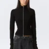 Top ajustado de manga larga con cuello alto y cremallera – Negro Top ajustado de manga larga con cuello alto y cremallera – Negro