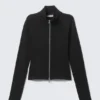 Top ajustado de manga larga con cuello alto y cremallera – Negro Top ajustado de manga larga con cuello alto y cremallera – Negro