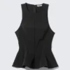 Top ajustado de nailon con peplum – Negro Top ajustado de nailon con peplum – Negro