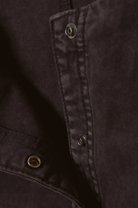 Top asimétrico sin mangas con volantes – Negro lavado Top asimétrico sin mangas con volantes – Negro lavado