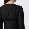 Top asimétrico transparente con cuello barco – Negro Top asimétrico transparente con cuello barco – Negro