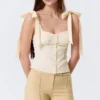 Top corsé ajustado con lazo – Blanco roto