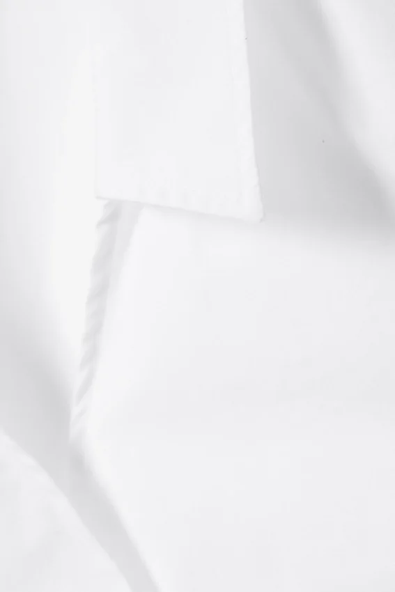 Top cruzado sin mangas de algodón – Blanco Top cruzado sin mangas de algodón – Blanco