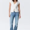 Top de algodón sin mangas con cuello en V – Blanco Top de algodón sin mangas con cuello en V – Blanco