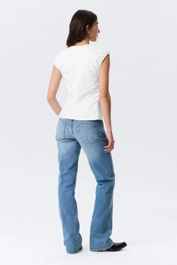 Top de algodón sin mangas con cuello en V – Blanco Top de algodón sin mangas con cuello en V – Blanco