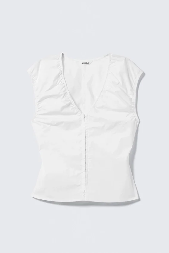 Top de algodón sin mangas con cuello en V – Blanco Top de algodón sin mangas con cuello en V – Blanco