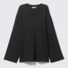 Top de jersey de manga larga de corte holgado – Negro Top de jersey de manga larga de corte holgado – Negro