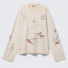 Top de manga larga con estampado y corte recto – Beige claro – Estampado urbano Top de manga larga con estampado y corte recto – Beige claro – Estampado urbano