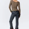 Top de manga larga, corte entallado y cuello redondo – Rayas beige/negro