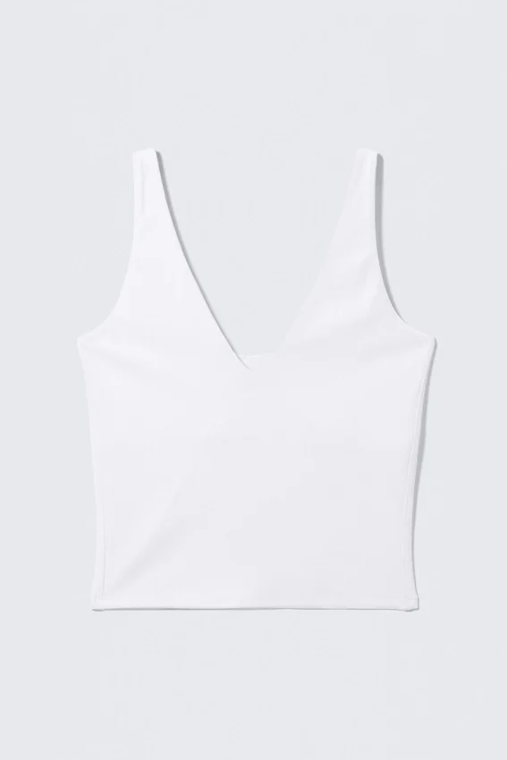 Top deportivo corto con escote pronunciado – Blanco Top deportivo corto con escote pronunciado – Blanco