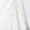 Top sin mangas con cuello barco y lazo – Blanco