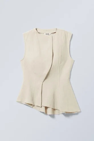 Top sin mangas con peplum asimétrico – Crudo