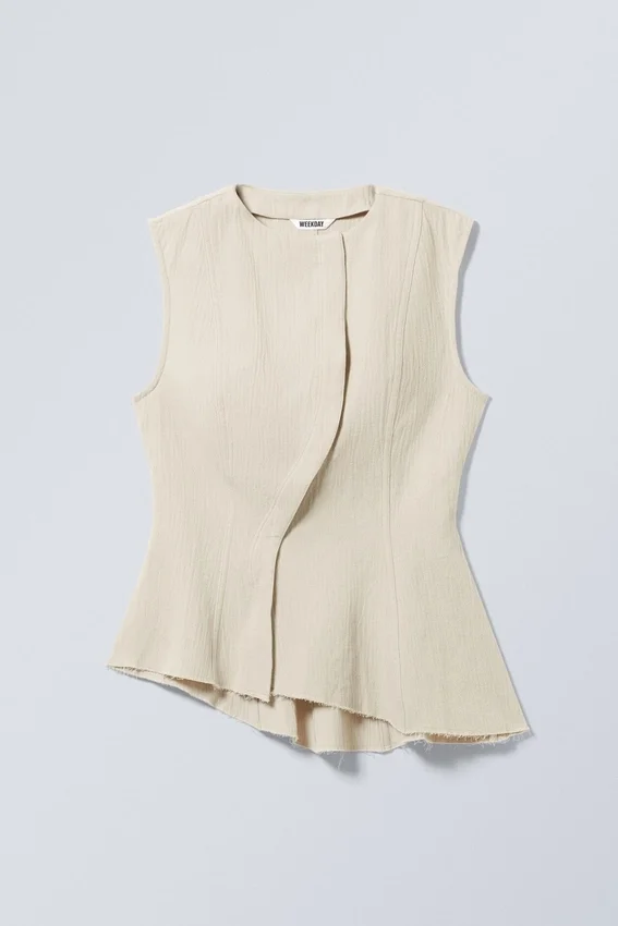 Top sin mangas con peplum asimétrico – Crudo Top sin mangas con peplum asimétrico – Crudo