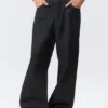 Vaqueros Astro Loose Baggy de talle medio, corte holgado y pierna ancha con acabado recubierto – Recubrimiento índigo Vaqueros Astro Loose Baggy de talle medio, corte holgado y pierna ancha con acabado recubierto – Recubrimiento índigo