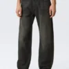 Vaqueros unisex Nebula de talle medio y corte holgado tipo Barrel – Negro Chelsea – Negro Vaqueros unisex Nebula de talle medio y corte holgado tipo Barrel – Negro Chelsea – Negro